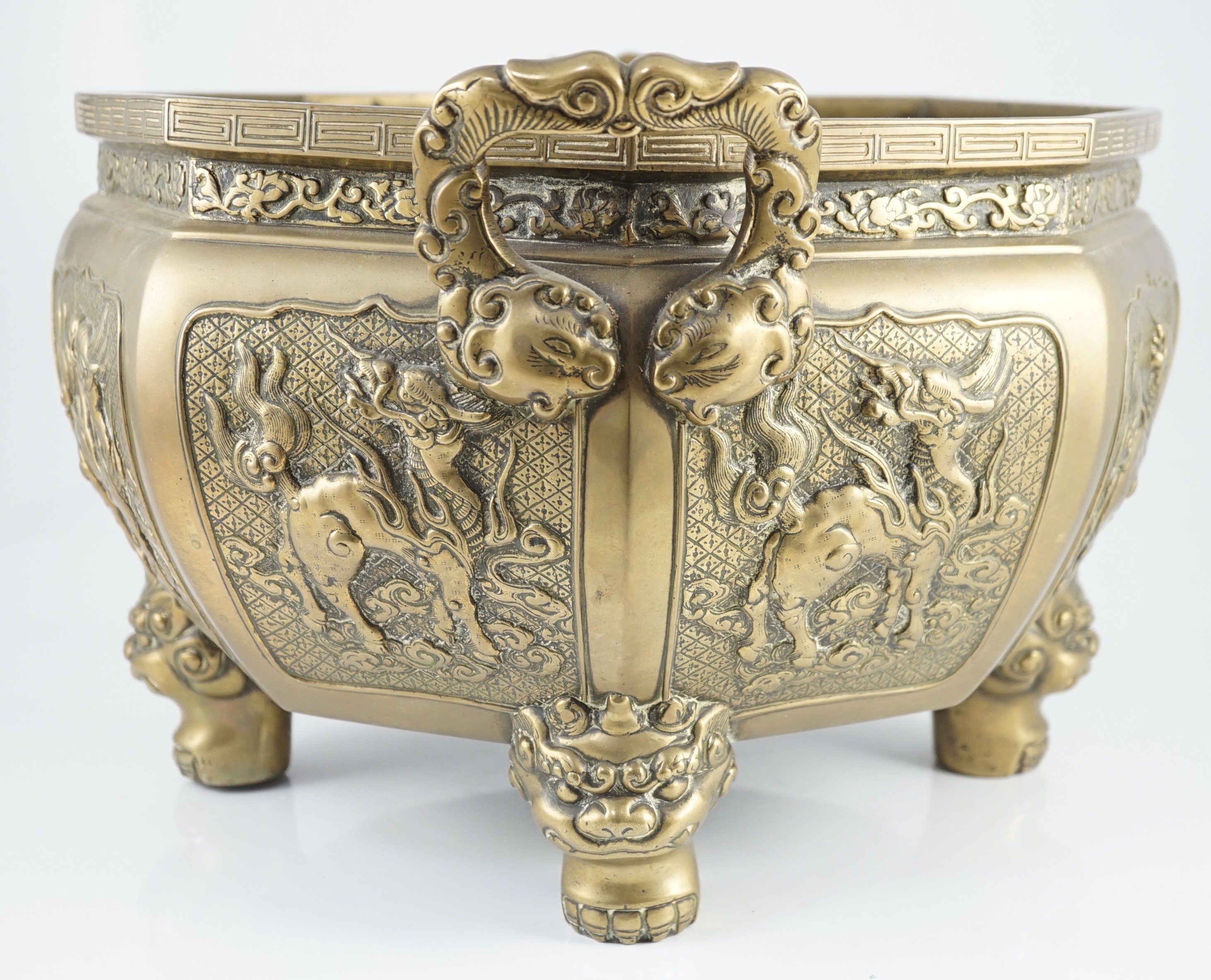 A large Chinese polished bronze octagonal jardiniere, 19th century, 48cm wide at handles, slight faults